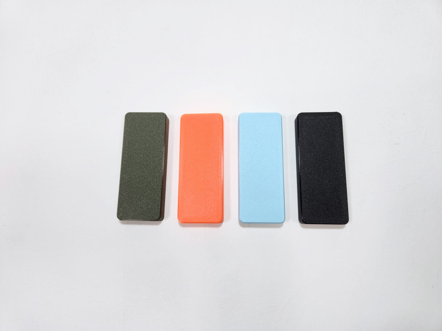 Four joint cases in different colors on a white background